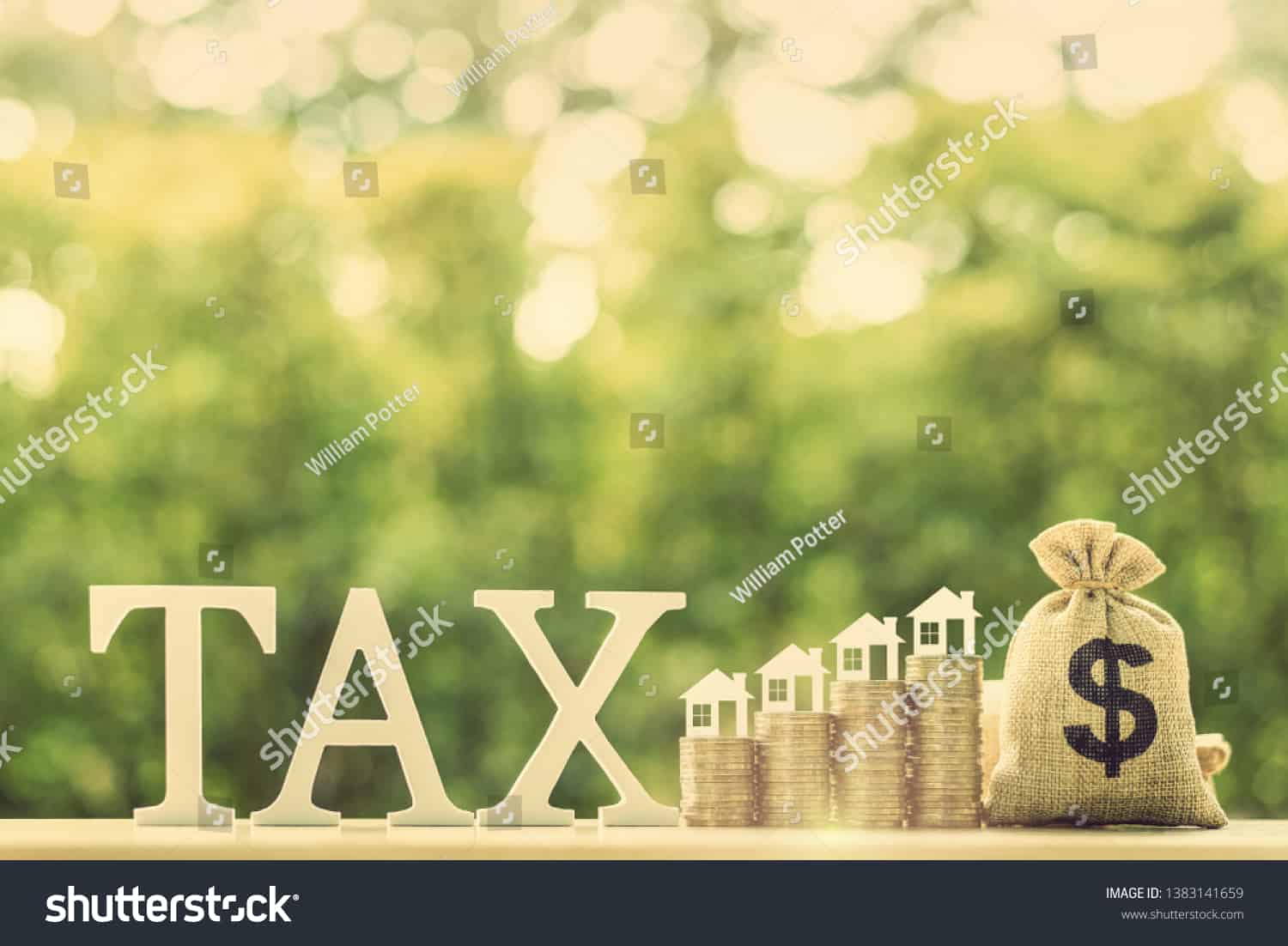 stock-photo-house-or-building-or-land-value-property-tax-local-development-tax-concept-word-tax-home-1383141659